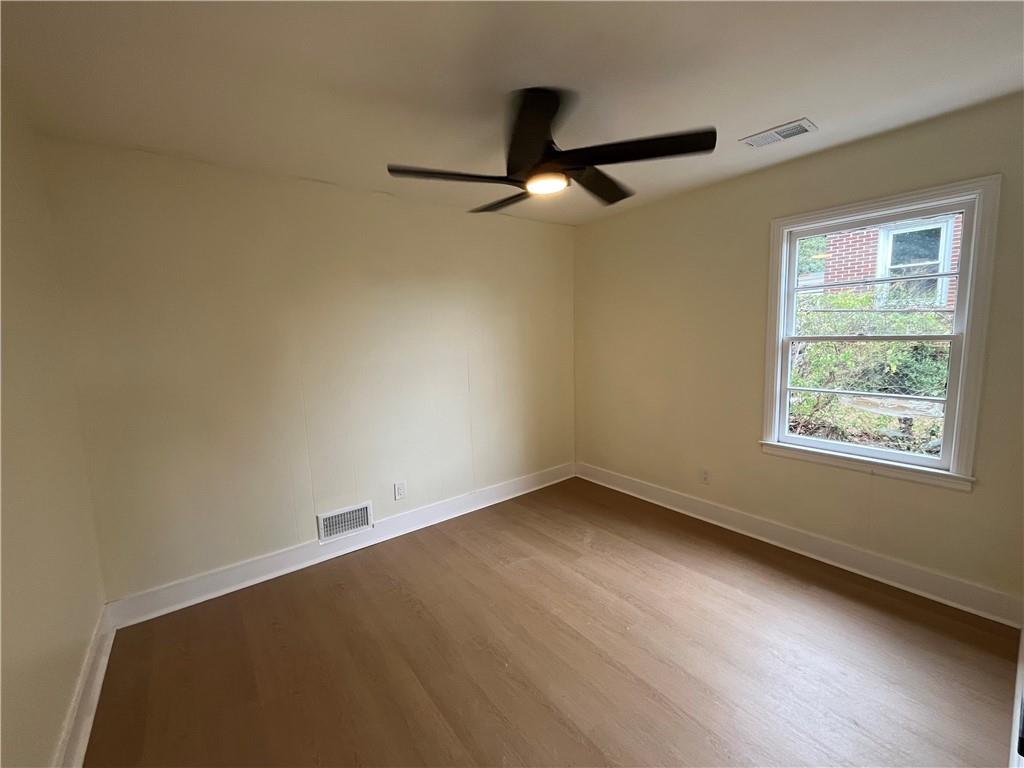 1645 Metropolitan Parkway Southwest, Unit A Atlanta, GA 30310 - Photo 22 of 26 an empty room with a window