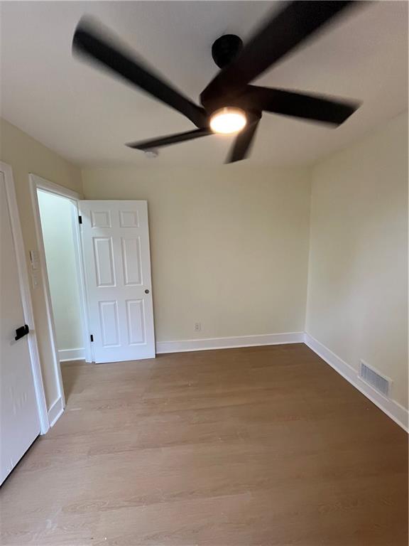 1645 Metropolitan Parkway Southwest, Unit A Atlanta, GA 30310 - Photo 23 of 26 a view of an empty room with a window