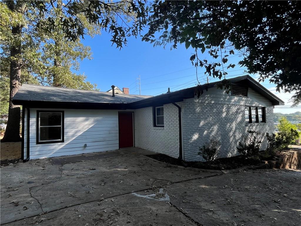 1645 Metropolitan Parkway Southwest, Unit A Atlanta, GA 30310 - Photo 24 of 26 a view of a house with a tree in the yard