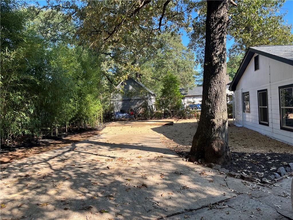 1645 Metropolitan Parkway Southwest, Unit A Atlanta, GA 30310 - Photo 26 of 26 a view of a yard with plants and trees