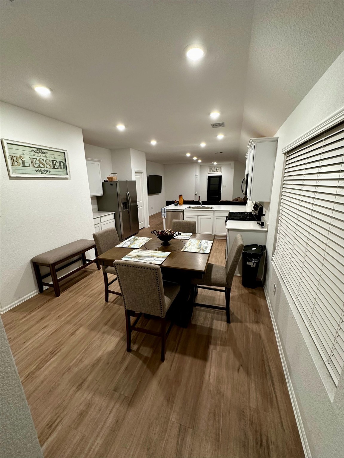 2023 Foxtail Crk Court Crosby, TX 77532 - Photo 11 of 22 a view of a dining room with furniture window and wooden floor