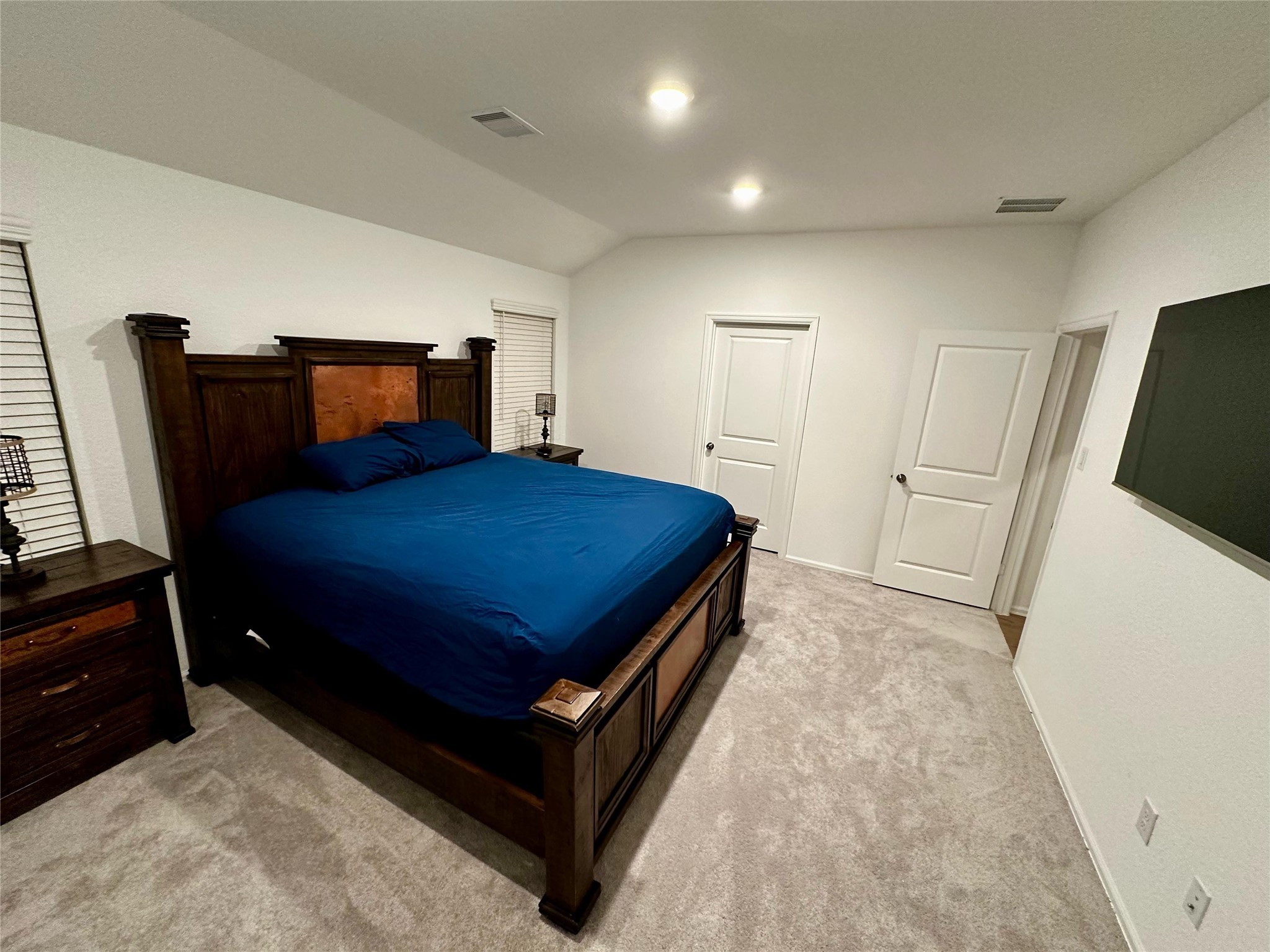 2023 Foxtail Crk Court Crosby, TX 77532 - Photo 13 of 22 a bedroom with a bed and wooden floor