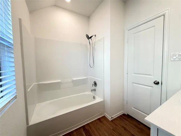 a bathroom with a sink toilet a mirror and shower