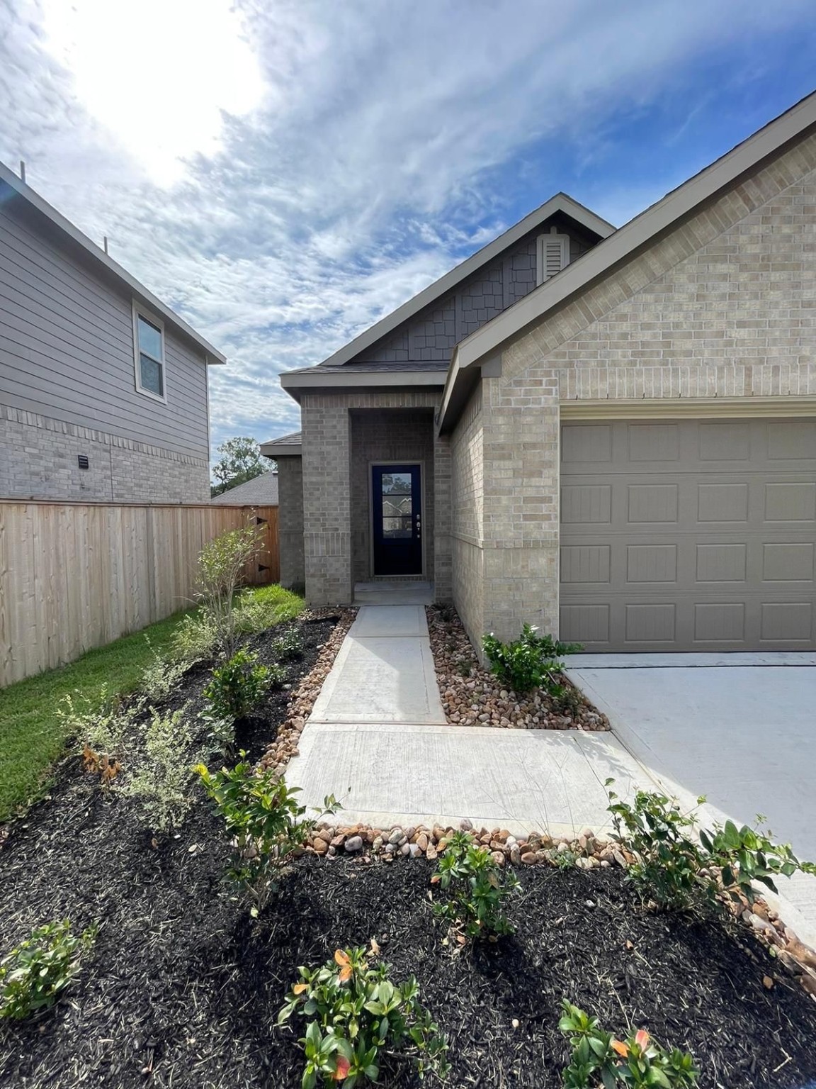 2023 Foxtail Crk Court Crosby, TX 77532 - Photo 2 of 22 a front view of a house with garden