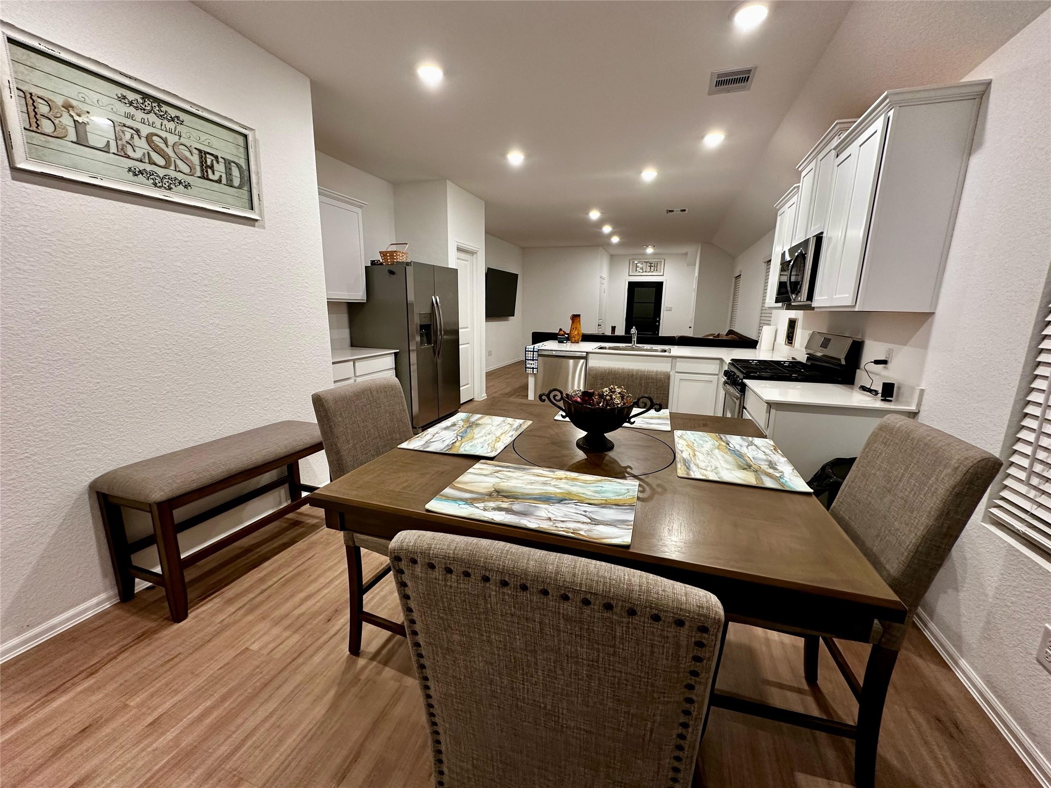 2023 Foxtail Crk Court Crosby, TX 77532 - Photo 7 of 22 a kitchen with a dining table chairs and refrigerator