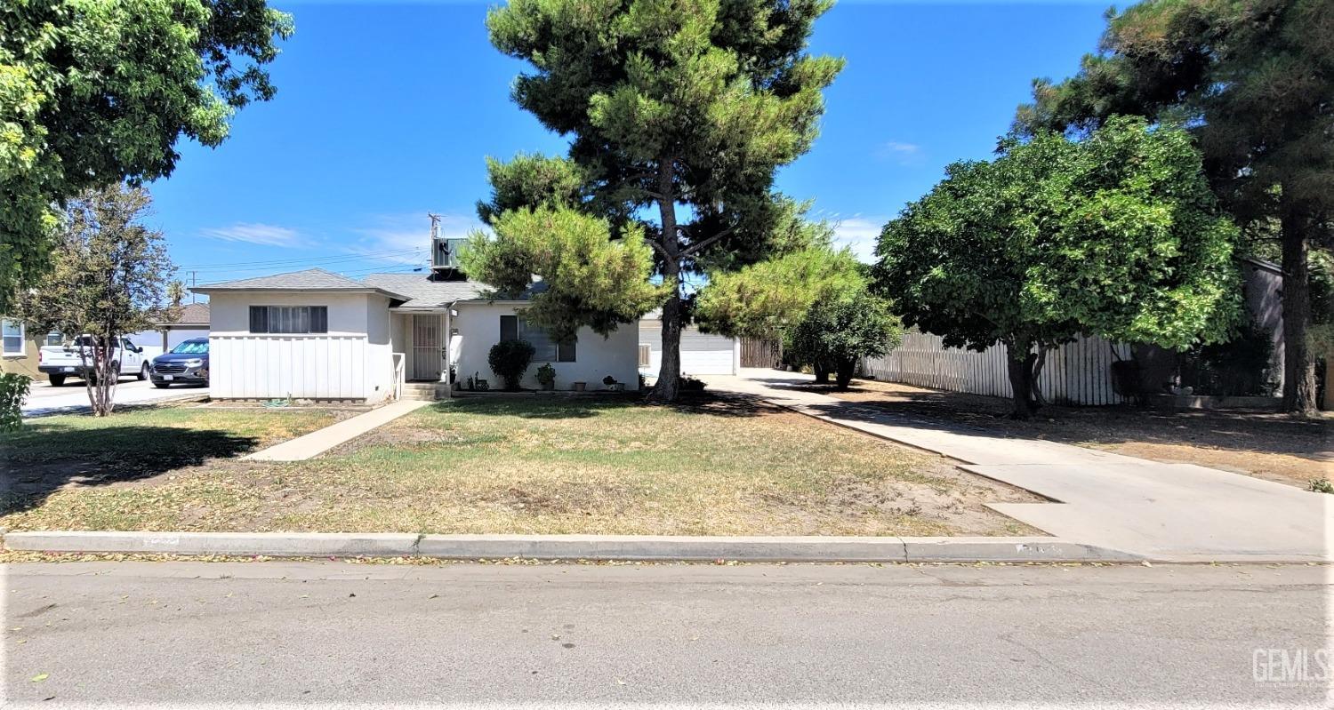 Undisclosed Address Delano, CA 93215 - Photo 1 of 23 a view of street with small fountain