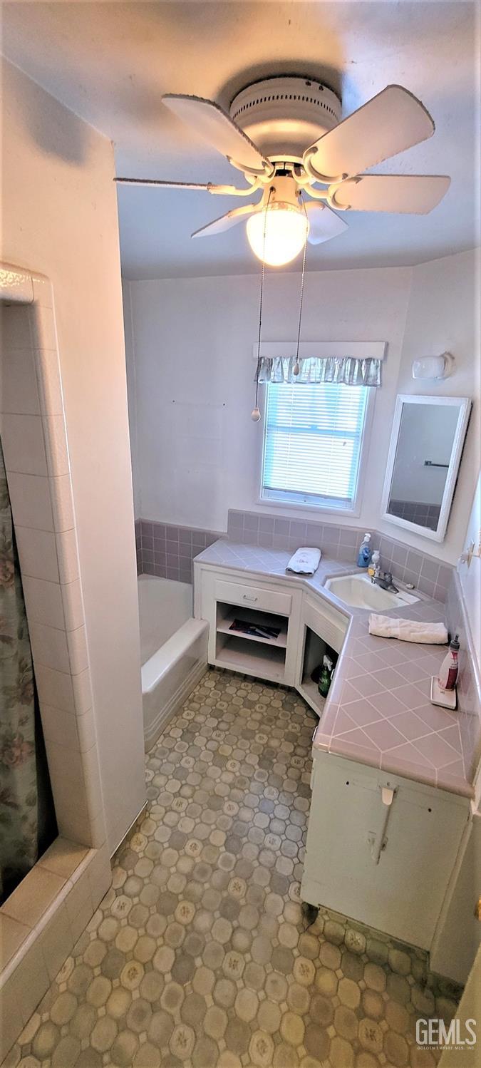Undisclosed Address Delano, CA 93215 - Photo 15 of 23 a bathroom with a sink and a mirror