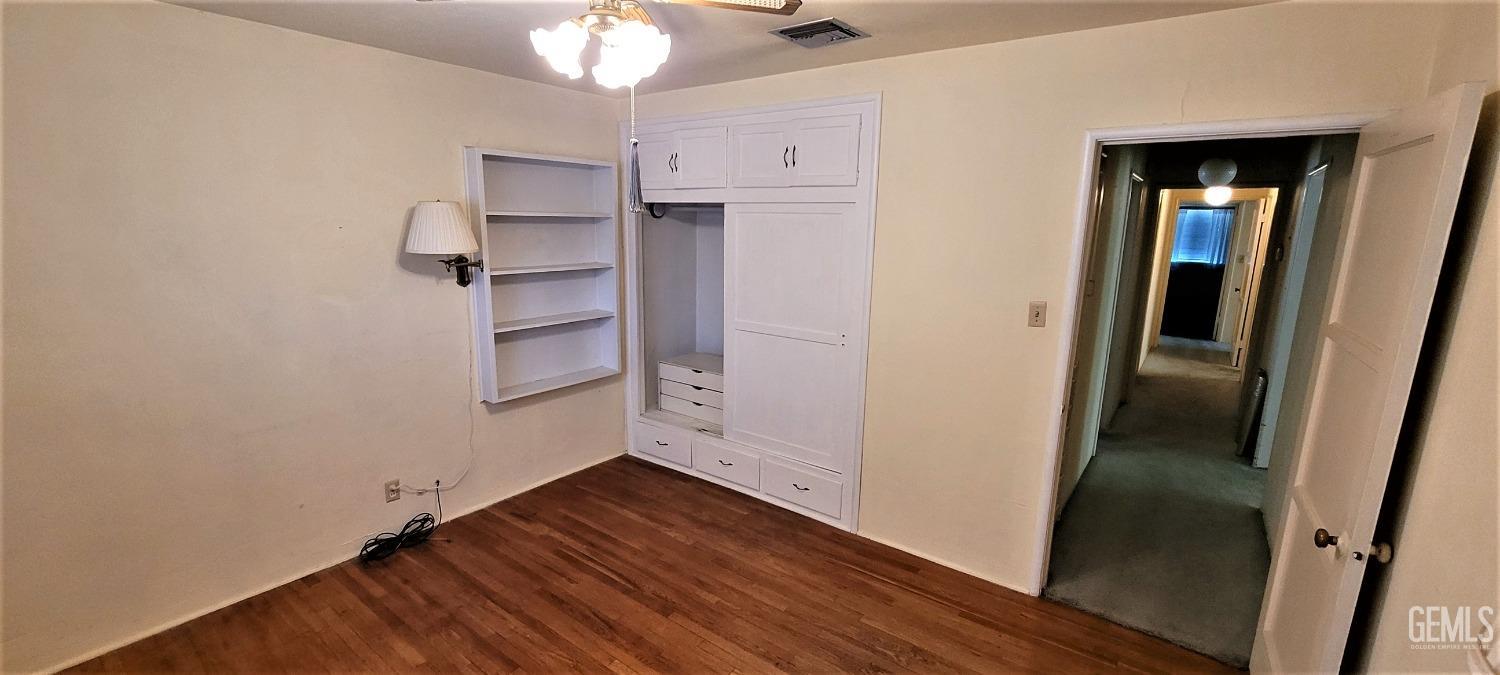 Undisclosed Address Delano, CA 93215 - Photo 16 of 23 a view of empty room with wooden floor