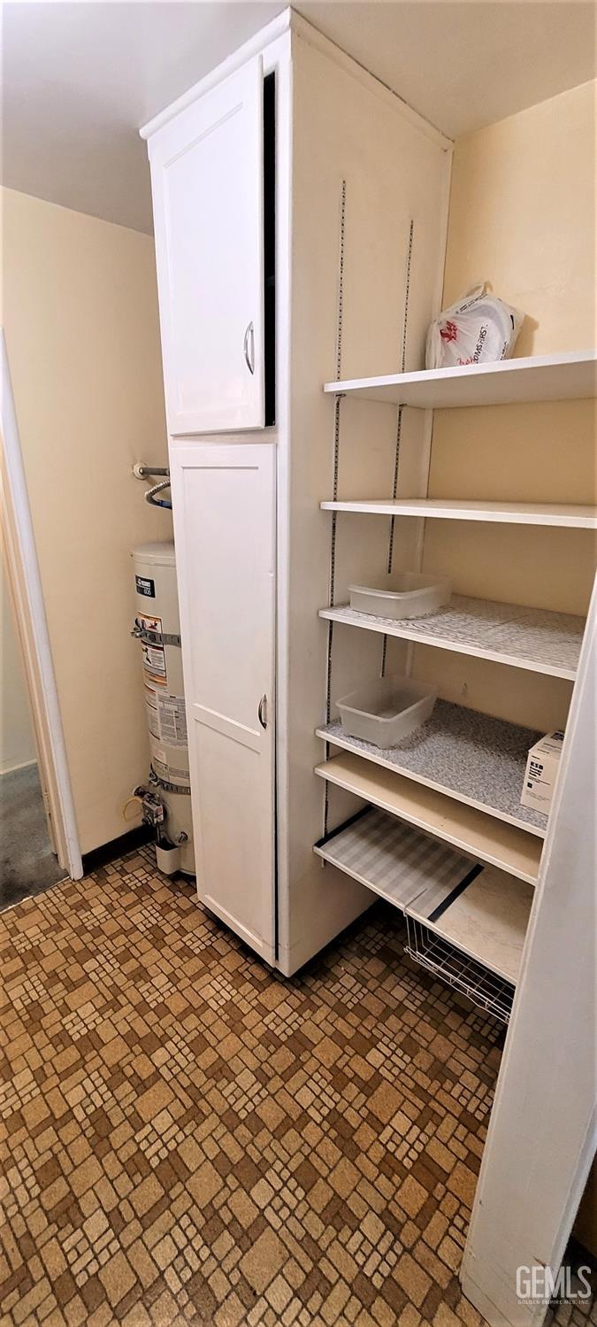 Undisclosed Address Delano, CA 93215 - Photo 18 of 23 a view of walk in closet with empty racks