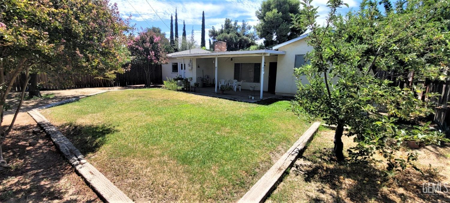Undisclosed Address Delano, CA 93215 - Photo 20 of 23 a view of a house with a yard and potted plants