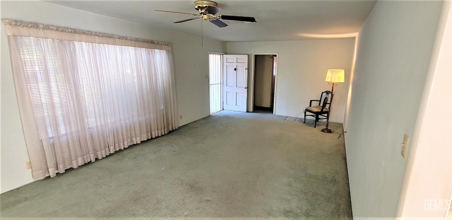 Undisclosed Address Delano, CA 93215 - Photo 4 of 23 a view of a livingroom with a staircase