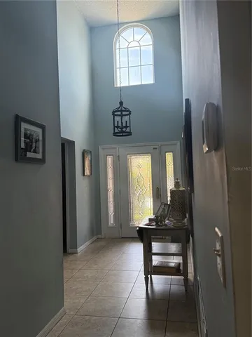 a view of room with window and wooden floor