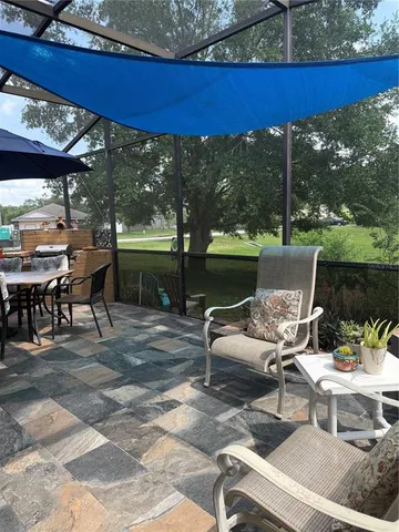 a view of a patio with a table chairs and a table