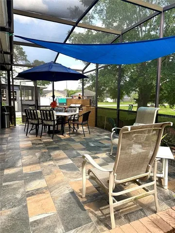 a view of a dining tables and chairs in a patio
