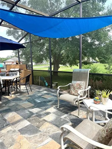 a view of a patio with a table chairs and a table