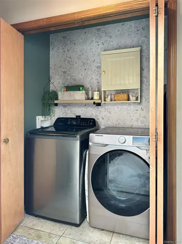 a utility room with dryer and washer
