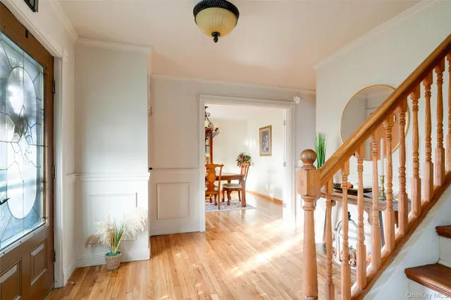 a view of living room and dining room with wooden floor
