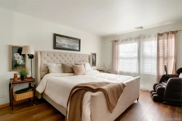 a bedroom with a bed and a couch