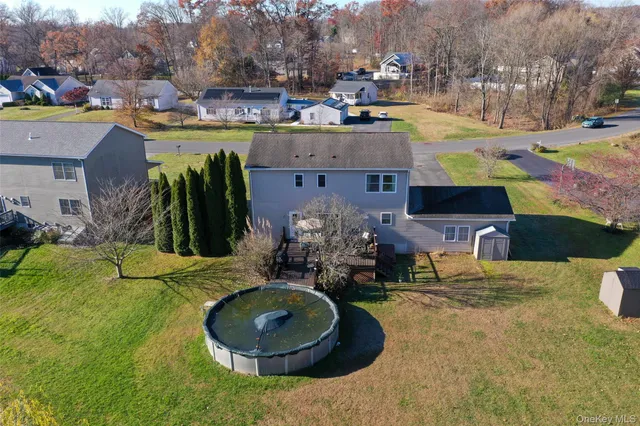 an aerial view of a house with outdoor space