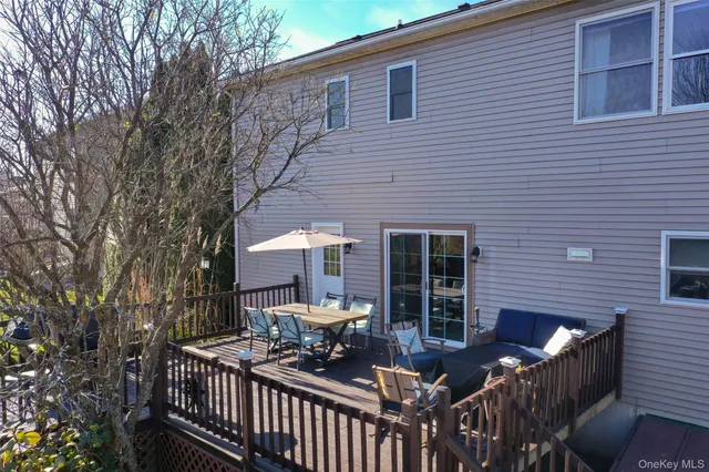 a front view of house with outdoor seating