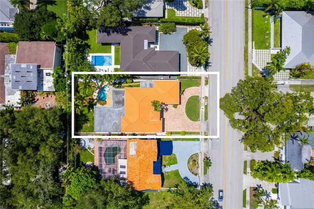 a view of a house with a backyard porch and sitting area