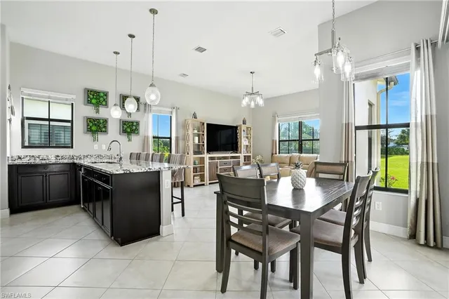 a kitchen with a table and chairs in it