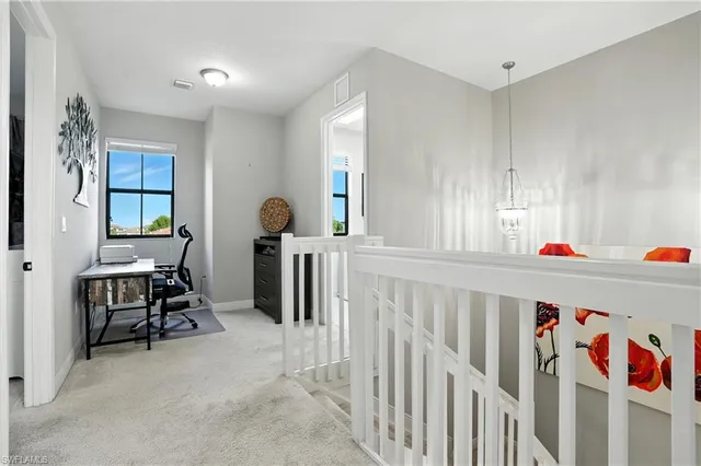 a bedroom with furniture and windows