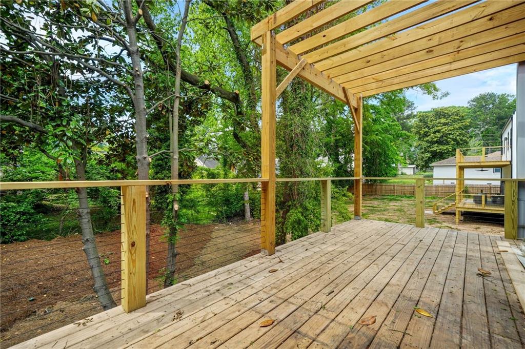 237 Altoona Place Southwest Atlanta, GA 30314 - Photo 19 of 63 a view of a deck with wooden floor and fence
