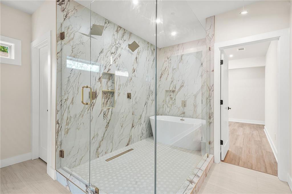 237 Altoona Place Southwest Atlanta, GA 30314 - Photo 35 of 63 a bathroom with a shower and a tub
