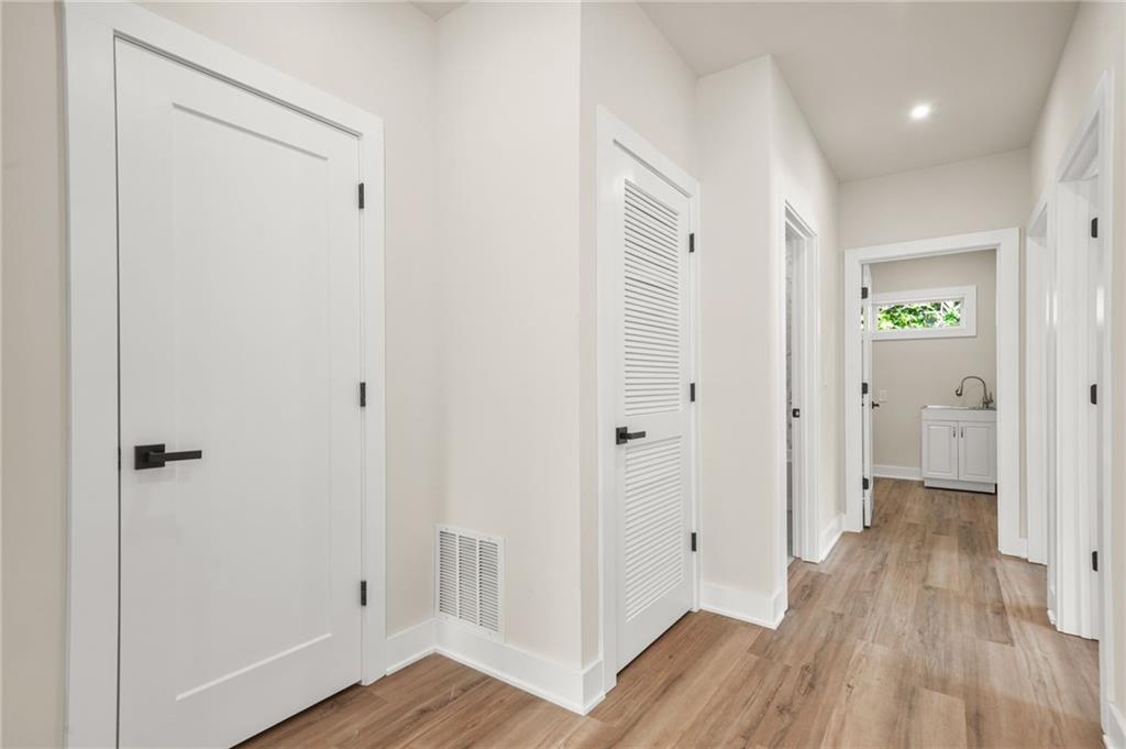 237 Altoona Place Southwest Atlanta, GA 30314 - Photo 39 of 63 a view of a hallway with wooden floor
