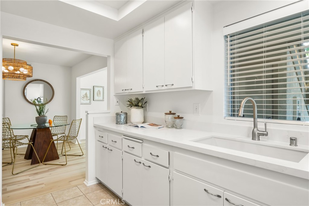 126 Clearbrook Irvine, CA 92614 - Photo 12 of 44 a kitchen with sink and cabinets