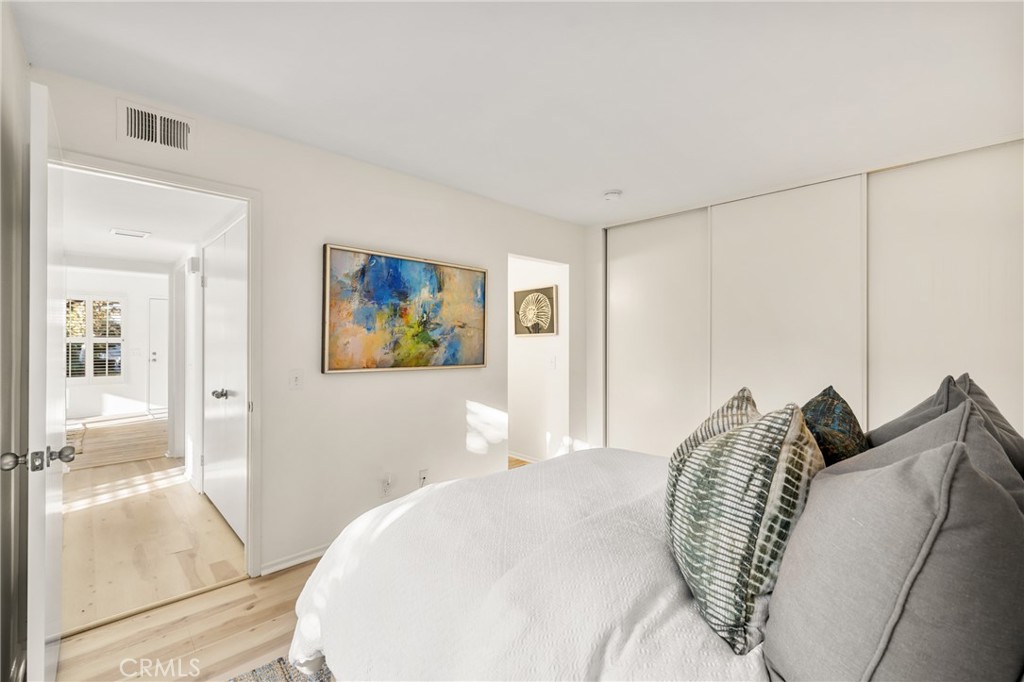 126 Clearbrook Irvine, CA 92614 - Photo 15 of 44 a bedroom with a bed and a large mirror