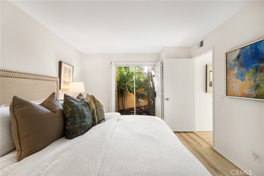 126 Clearbrook Irvine, CA 92614 - Photo 16 of 44 a bedroom with a bed and a large window