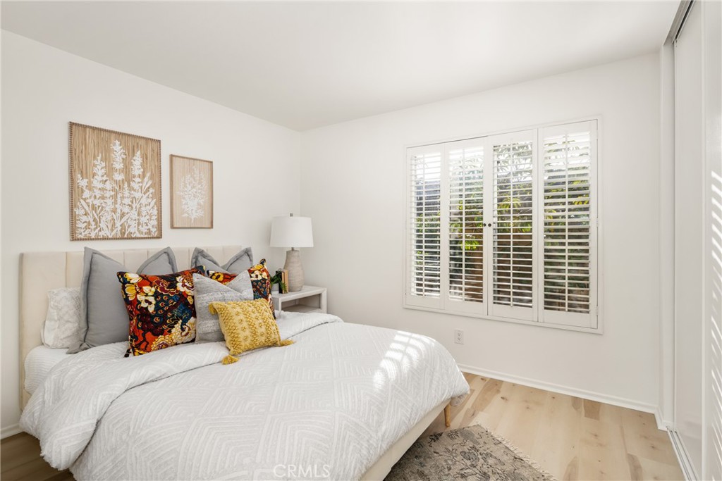 126 Clearbrook Irvine, CA 92614 - Photo 20 of 44 a bedroom with a bed and a window