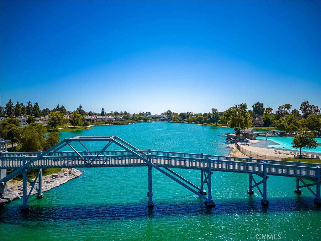 126 Clearbrook Irvine, CA 92614 - Photo 35 of 44 a view of a lake with couches and wooden fence