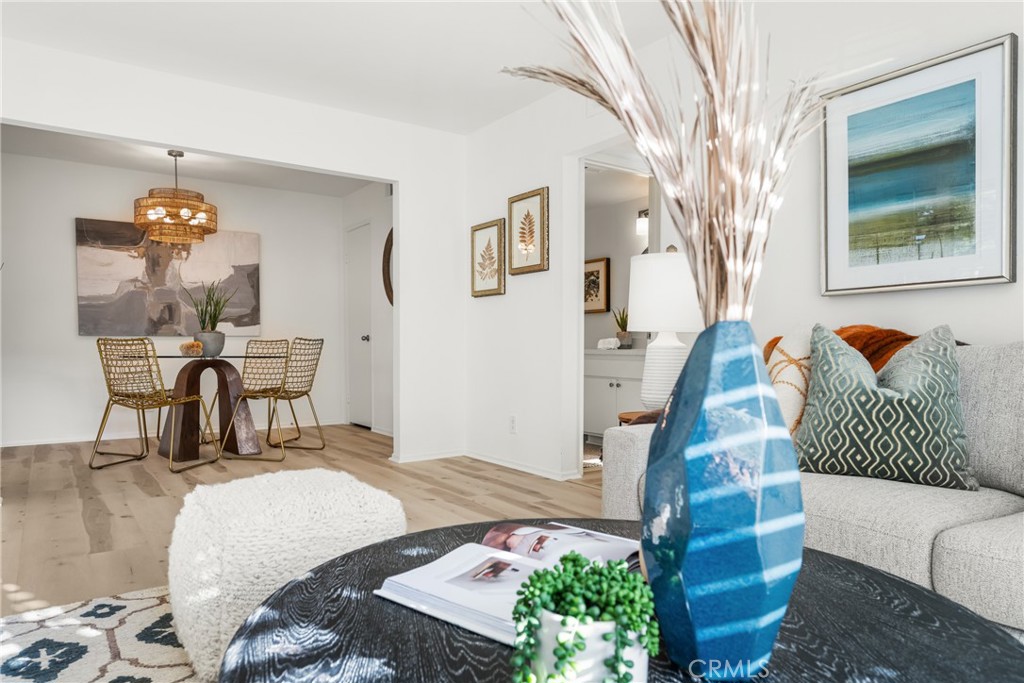 126 Clearbrook Irvine, CA 92614 - Photo 4 of 44 a bedroom with a bed and wooden floor