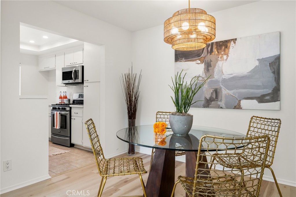 126 Clearbrook Irvine, CA 92614 - Photo 9 of 44 a view of a dining room with furniture and wooden floor