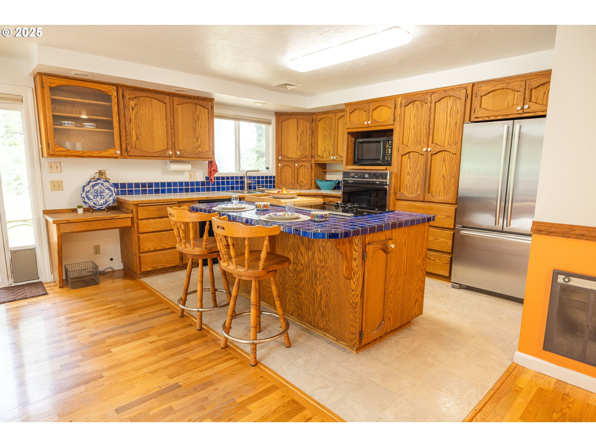 39287 Jasper Lowell Road Lowell, OR 97452 - Photo 12 of 13 a kitchen with stainless steel appliances granite countertop a stove top oven a sink a dining table and chairs