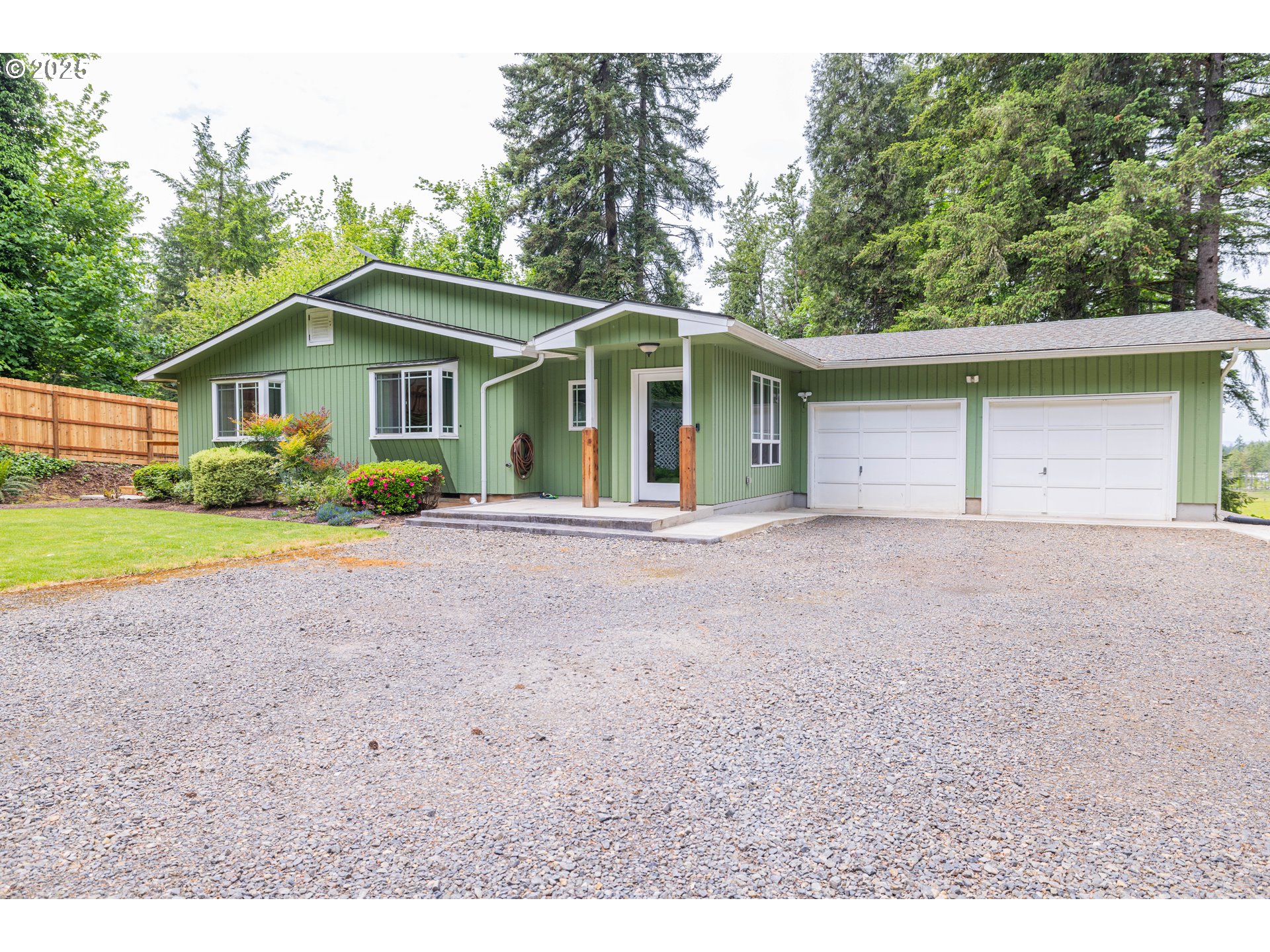 39287 Jasper Lowell Road Lowell, OR 97452 - Photo 10 of 13 a front view of a house with a yard and trees