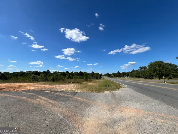 a view of a lake in the middle of a town