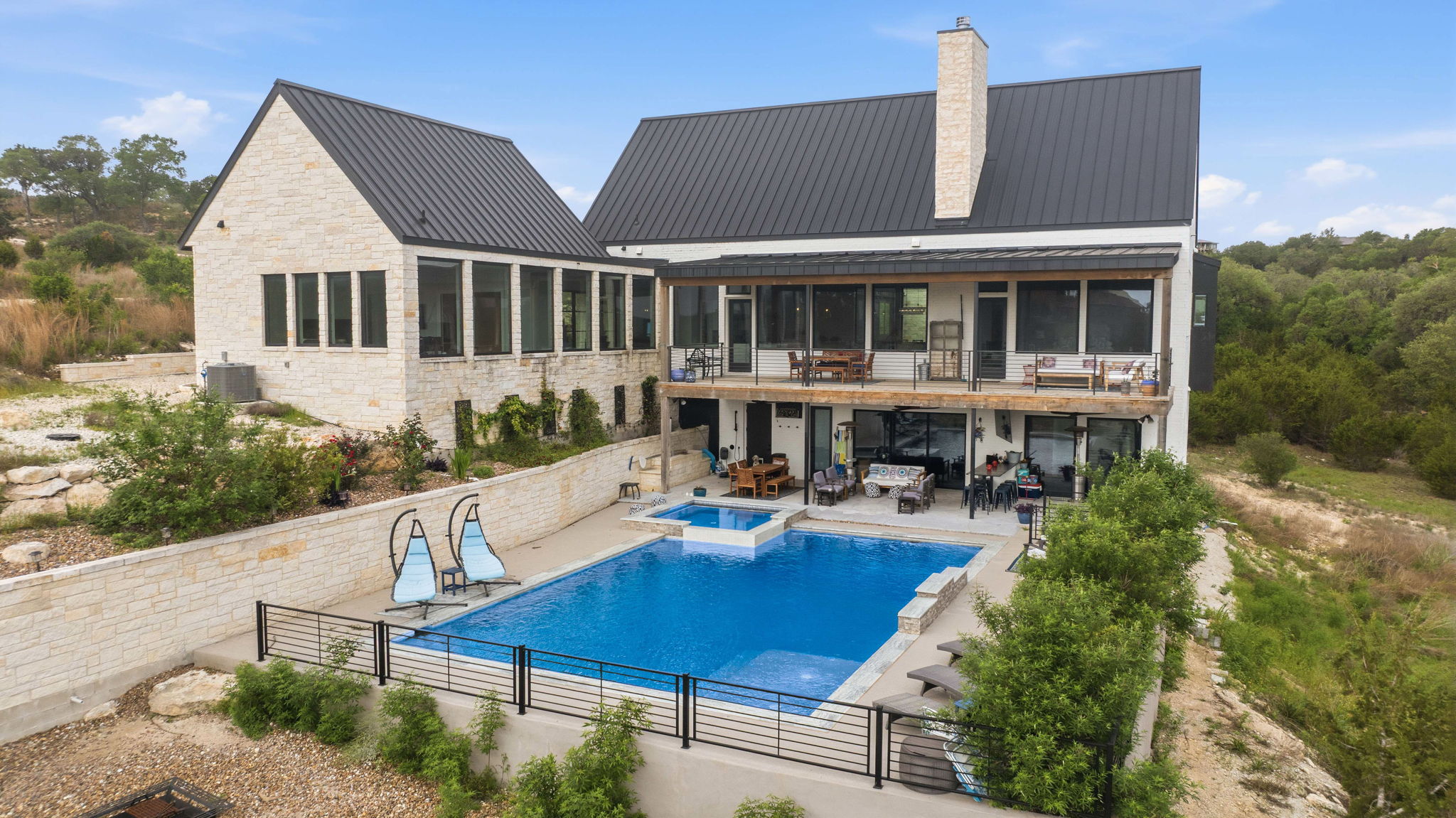194 Placid Way Spring Branch, TX 78070 - Photo 35 of 37 Multi-level exterior with a large swimming pool and integrated spa