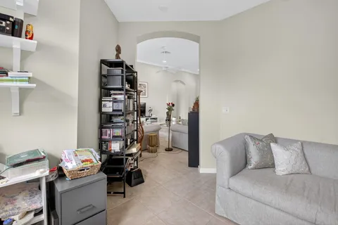 a living room with a couch and a book shelf