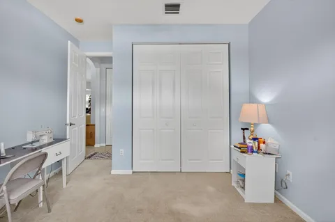 a bathroom with a sink a toilet and shower curtain