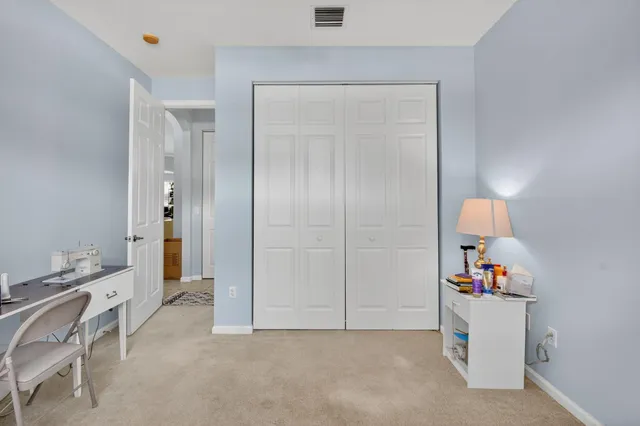 a bathroom with a sink a toilet and shower curtain