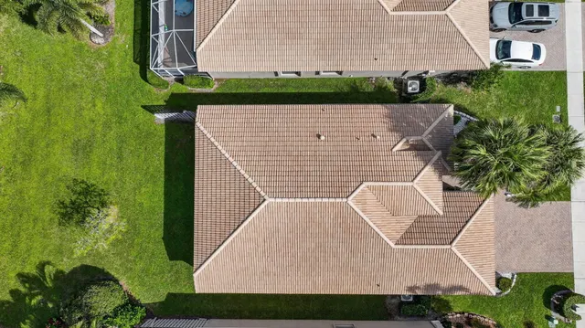 a view of a swimming pool with a yard