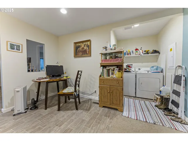 a bedroom with bed and a tv