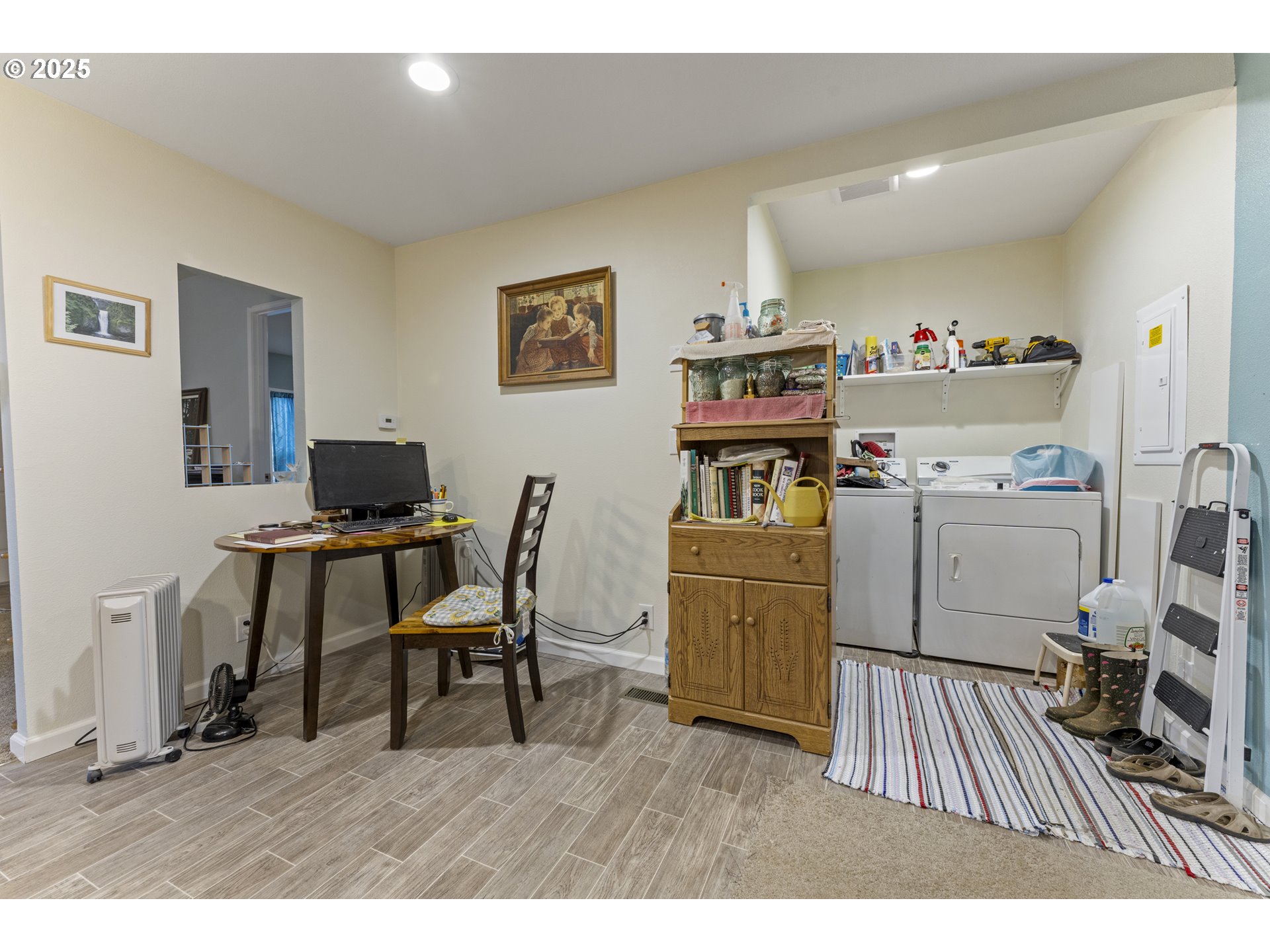 69127 Wildwood Road, Unit 4 North Bend, OR 97459 - Photo 11 of 20 a workspace with furniture and wooden floor