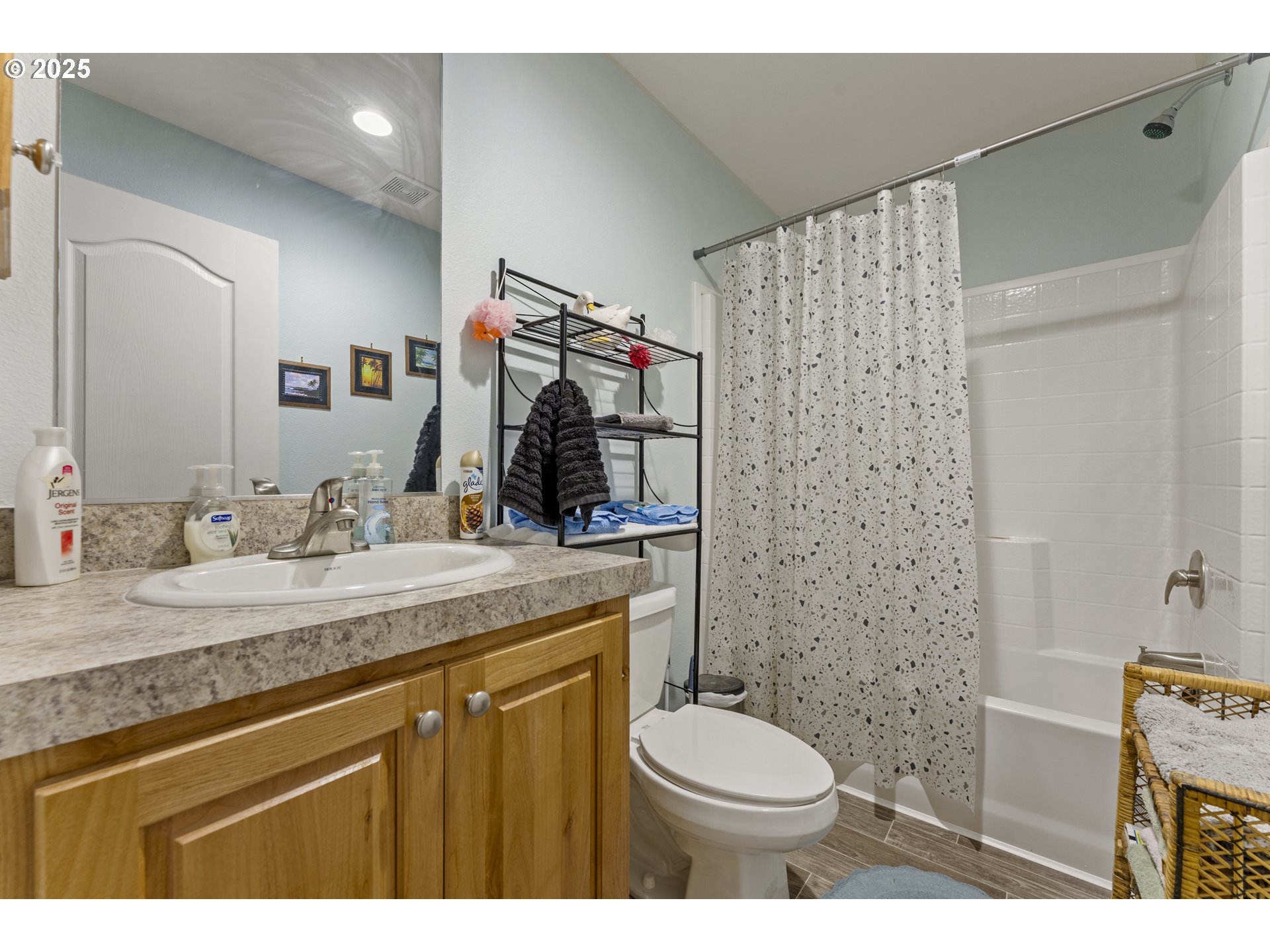 69127 Wildwood Road, Unit 4 North Bend, OR 97459 - Photo 17 of 20 a bathroom with a granite countertop sink toilet and shower