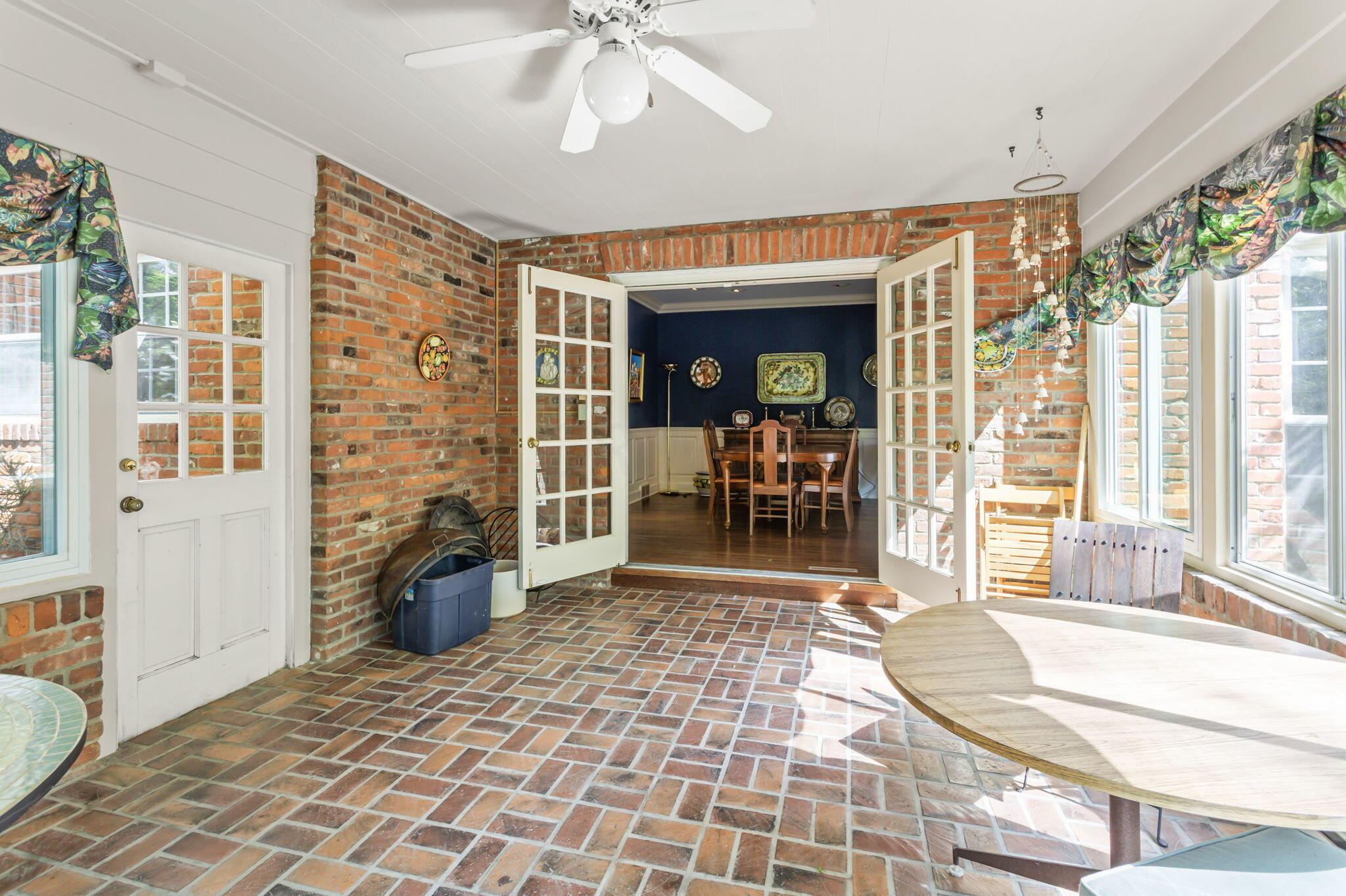 2111 Cheltenham Road Columbus, OH 43220 - Photo 18 of 64 A door leading out into the brick patio and built in grill are accessible through the four season room.