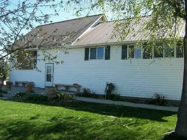 1320 Thacker Road Granger, WA 98932 - Photo 1 of 4 a aerial view of a house with a yard
